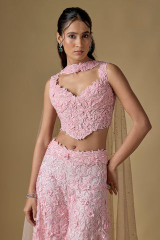 Waist-up close-up of the baby pink sweetheart corset in raised floral appliqué with a collar by Asaga at Mrs. G