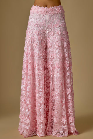 Detail of the baby pink wide-leg sharara covered in floral appliqué from waist to hem by Asaga at Mrs. G