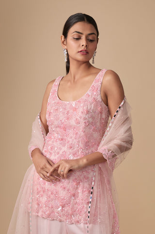 Waist-up view of the scoop-neck kurti with raised pink bead and sequin flowers and net dupatta by Asaga at Mrs. G