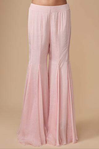 Close-up of the plain baby pink satin sharara with wide flared gores by Asaga at Mrs. G