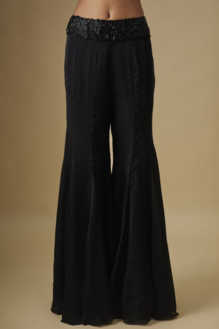 Close-up of the black satin sharara with godet panels and a beaded waistband by Asaga at Mrs. G