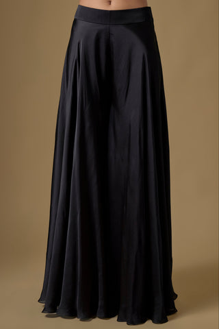 Detail of the black wide satin organza sharara with a smooth fall by Asaga at Mrs. G