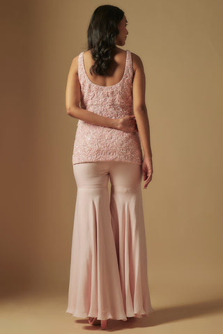 Back view of blush short kurti with a scoop back and flared satin sharara by Asaga at Mrs. G