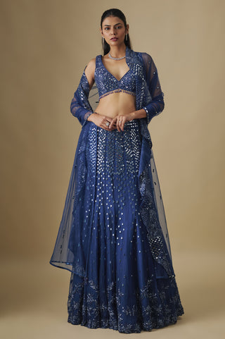 Front view of an electric blue mirror work lehenga with a V-neck blouse and sheer net dupatta by Asaga at Mrs. G
