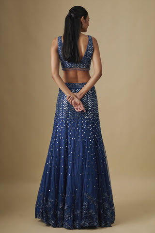 Back view of the electric blue scooped-back blouse and flared mirror work skirt by Asaga at Mrs. G