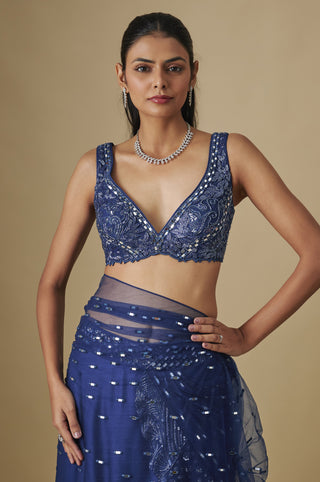 Front view of the electric blue V-neck blouse and sheer net waist band over a satin skirt by Asaga at Mrs. G