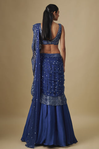 Back view of the electric blue scooped-back blouse and pallu over the flared skirt by Asaga at Mrs. G