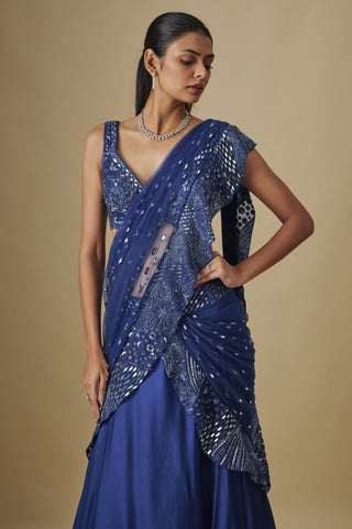Waist-up view of an electric blue pre-draped saree with a zentangle blouse and ruffled mirror drape by Asaga at Mrs. G