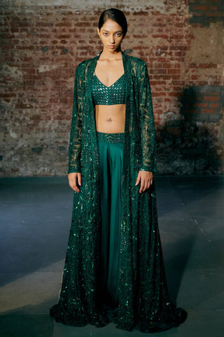 Front view of an emerald green long sheer jacket over a mirror blouse and flared sharara by Asaga at Mrs. G