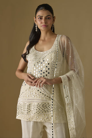 Waist-up view of the ivory scoop-neck kurti with mirrors and pearl-toned beads by Asaga at Mrs. G