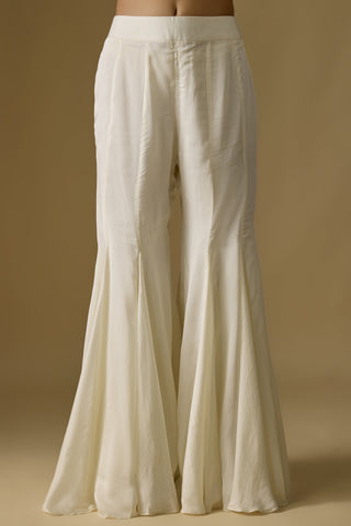 Back view of the ivory sleeveless kurti and flared sharara by Asaga at Mrs. G