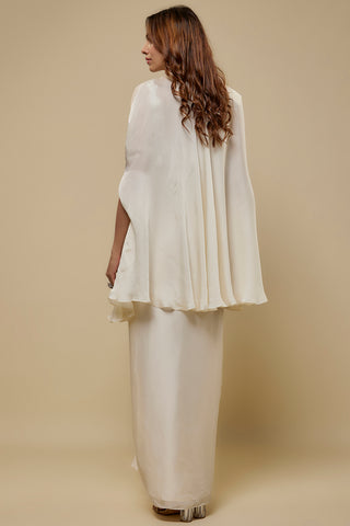 Back view of the ivory cape falling over the plain back of the satin skirt by Asaga at Mrs. G