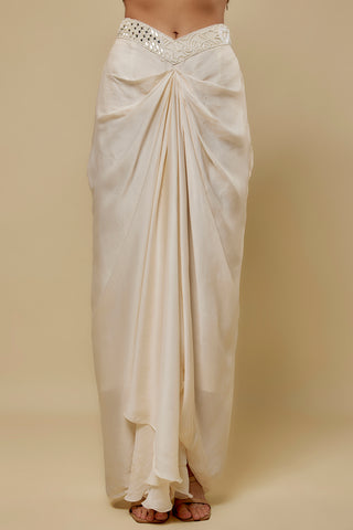 Waist-down view of the ivory satin drape skirt with a V-shaped mirror waistband by Asaga at Mrs. G