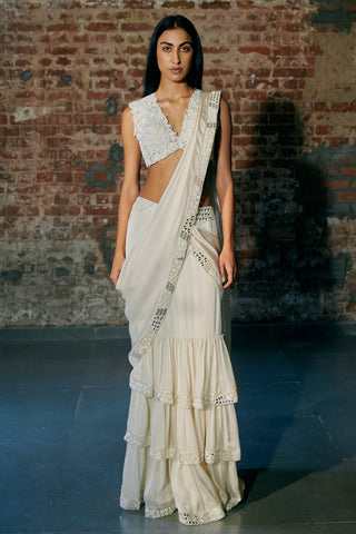 Front view of the ivory tiered saree standing straight with the pallu over the left shoulder by Asaga at Mrs. G