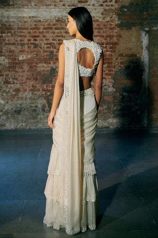 Back view of the ivory saree with a keyhole blouse back and the draped pallu by Asaga at Mrs. G