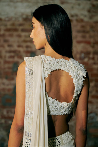 Side close-up of the ivory blouse back with its leaf appliqué edging by Asaga at Mrs. G