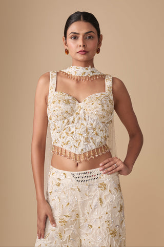 Waist-up view of the sweetheart corset blouse with beaded tassel hem and floral choker collar by Asaga at Mrs. G