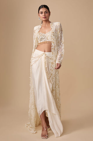 Full-length front view of the ivory gold long net jacket over the sweetheart blouse and draped skirt with pearl chains by Asaga at Mrs. G