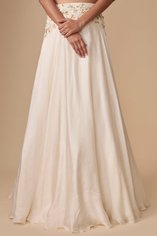 Close-up of the plain flowing satin lehenga skirt and the embroidered waistband by Asaga at Mrs. G