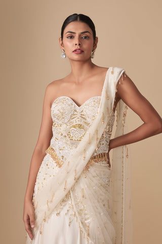 Waist-up view of the sweetheart corset with beaded tassel hem and sequined net pallu on one shoulder by Asaga at Mrs. G