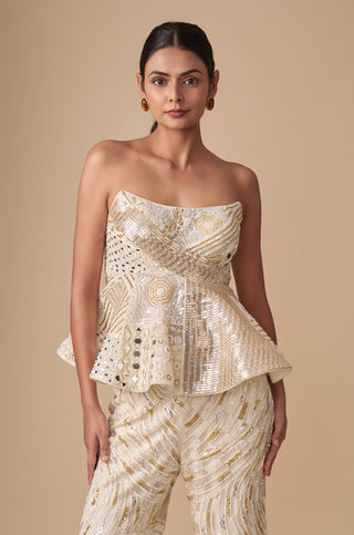 Waist-up view of the padded strapless peplum top with crossover sequin band and mirror panels by Asaga at Mrs. G