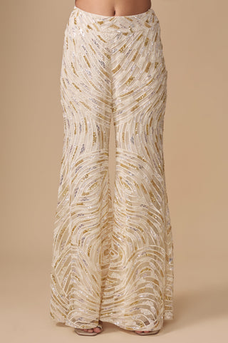 Close-up of the swirling gold and silver sequin embroidery on the ivory sharara by Asaga at Mrs. G