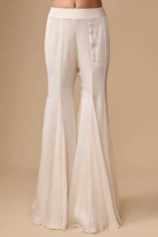 Close-up of the gored satin organza sharara with a plain waistband in ivory by Asaga at Mrs. G