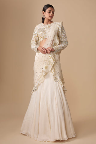 Full-length front view of the ivory gold fish-cut pre-draped saree with mirror work and full-sleeve blouse by Asaga at Mrs. G