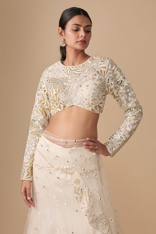 Close-up of the round-neck blouse with gold swirl embroidery and the pearl-trimmed saree waist by Asaga at Mrs. G