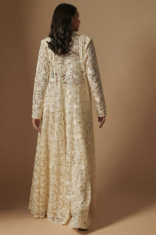 Back view of ivory sheer floral lace-work long jacket over a wide-leg sharara by Asaga at Mrs. G
