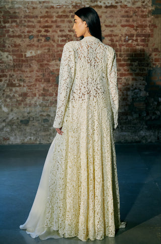 Back view of the ivory long jacket with all-over leaf embroidery and the trailing sharara hem by Asaga at Mrs. G