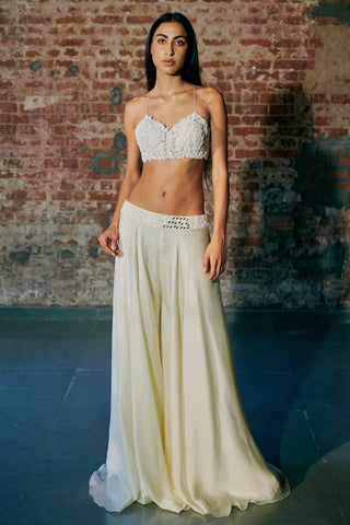 Front view of the ivory leaf-embroidered blouse with the flared satin sharara and no jacket by Asaga at Mrs. G