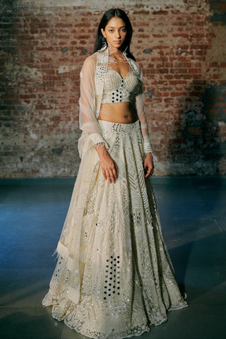Full-length view of the ivory lehenga with the dupatta falling over the flared can-can skirt by Asaga at Mrs. G