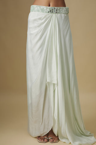 Close-up of the mint draped satin skirt with a mirror waistband and tulip hem by Asaga at Mrs. G