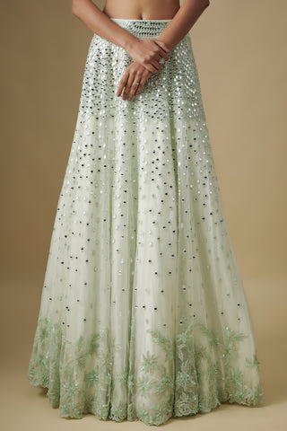 Close-up of the mint skirt with mirrors fading into a floral appliqué hem by Asaga at Mrs. G