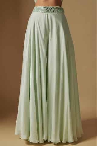 Waist-down view of mint wide flowing sharara with a mirror and thread work waistband by Asaga at Mrs. G