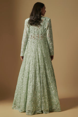 Back view of the mint cutwork long jacket flowing over the flared skirt by Asaga at Mrs. G