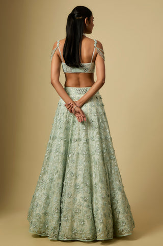 Back view of the mint embroidered lehenga with a strappy bustier blouse by Asaga at Mrs. G