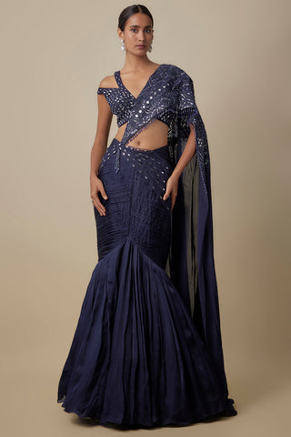 Full-length front view of the navy blue pre-draped saree with a fishtail skirt and mirror-work blouse by Asaga at Mrs. G