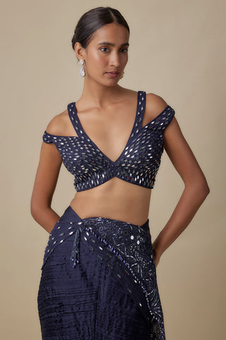 Waist-up view of the navy cold-shoulder blouse with mirror work and a mirror and thread pallu by Asaga at Mrs. G