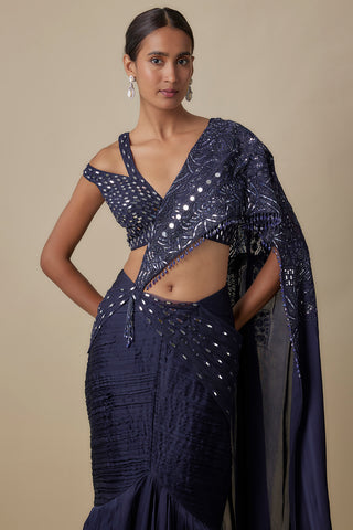 Three-quarter view of the navy mirror-embroidered pallu wrapping the bodice and pleated skirt by Asaga at Mrs. G