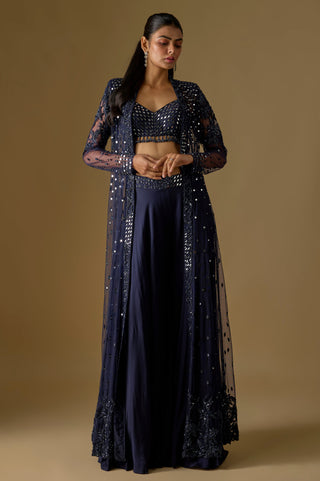 Full-length front view of the navy sheer long jacket over a mirror work blouse and satin sharara by Asaga at Mrs. G