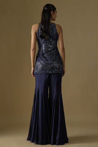Back view of the navy blue sleeveless kurti and flared satin sharara by Asaga at Mrs. G