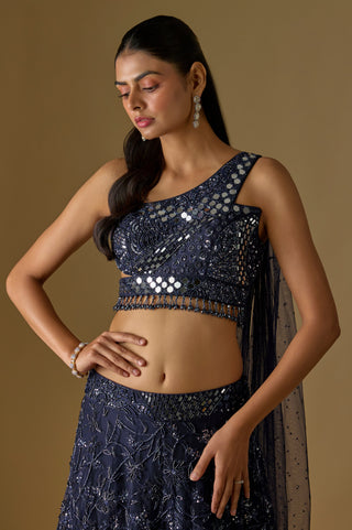 Waist-up close-up of the one-shoulder mirror strap, bodice panel and beaded fringe on the navy blouse by Asaga at Mrs. G