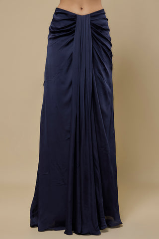 Waist-down view of the navy satin skirt with a pleated front drape by Asaga at Mrs. G