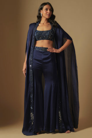Front view of navy ibex mirror work crop blouse, flared sharara and floor-length sheer cape by Asaga at Mrs. G