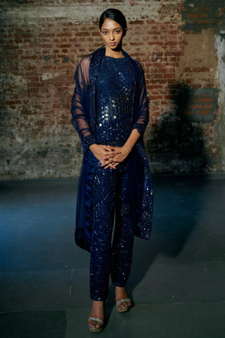Front view of the navy blue mirror and sequin kurta with slim ankle pants and a sheer net dupatta by Asaga at Mrs. G