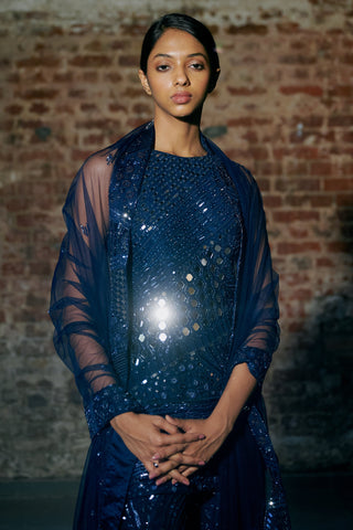 Waist-up view of the navy blue round-neck kurta with mirrors and embroidered cuffs under the net dupatta by Asaga at Mrs. G