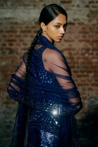 Over-the-shoulder view of the navy blue kurta's mirror work and the sheer embroidered dupatta by Asaga at Mrs. G
