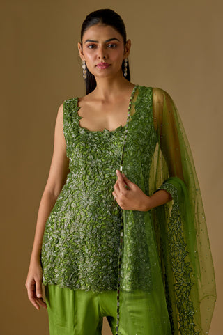 Waist-up close-up of the olive leaf appliqué kurti and the net dupatta with a mirror-trimmed edge by Asaga at Mrs. G